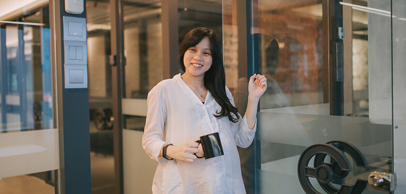 Woman knocking glass door