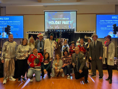 LCS employees dressed up for the 2023 Holiday Party