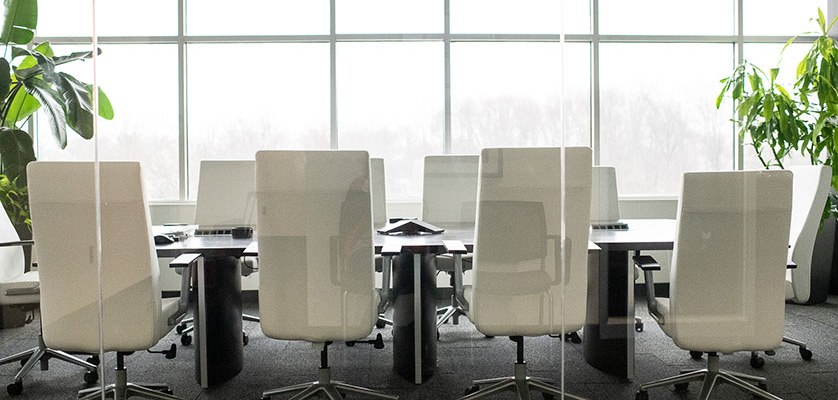 Corporate board room with white chairs