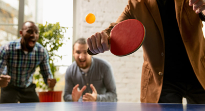 Employee Engagement Ideas - Employees playing table tennis