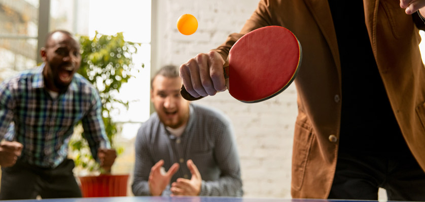 Employee Engagement Ideas - Employees playing table tennis